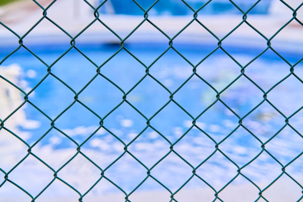 istock swimming pool safety fence 1401608112