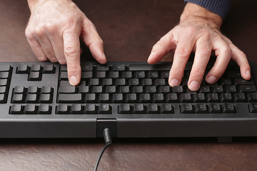 Man is typing on keyboard