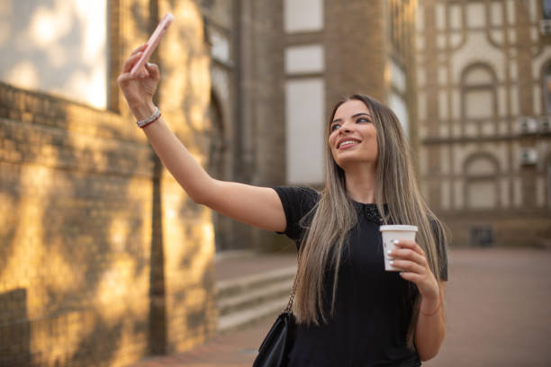istock Happy woman using phone stock photo 1401609111