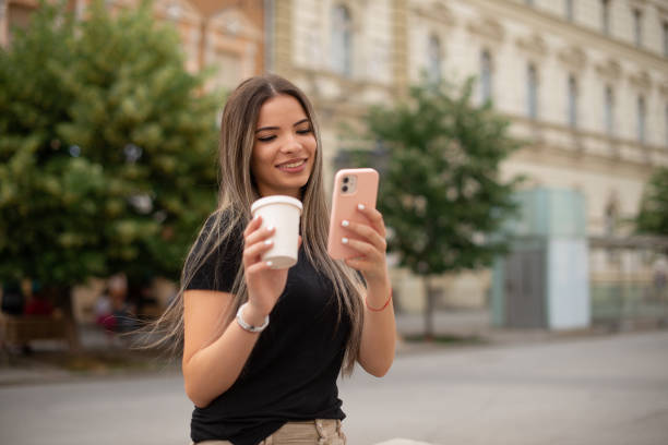 istock Happy woman using phone stock photo 1401609150