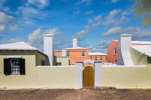 A wooden gate in the wall surrounding a group of houses off Church Lane in St. George, Bermuda