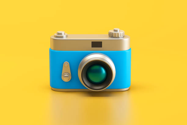 istock Vintage camera isolated on yellow background 1401610192
