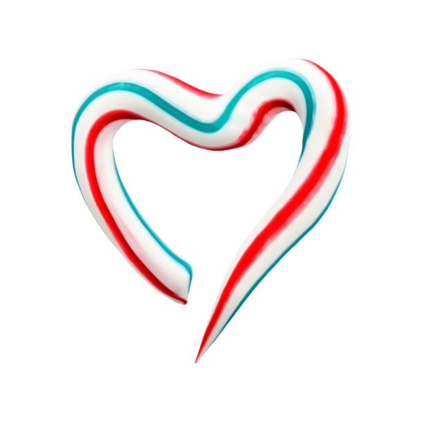 istock Heart symbol is made of three-color toothpaste on white isolated background, concept abstract background 1401610422