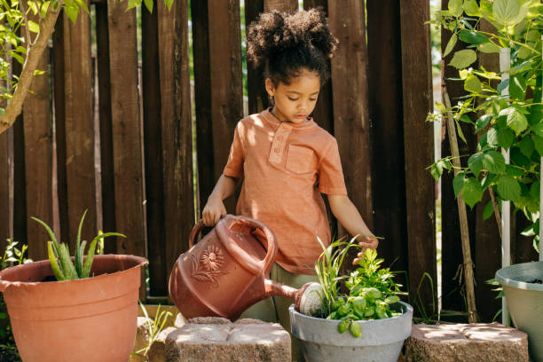 istock Little girl gardening on the backyard 1401611355