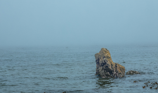 The Peninsula of Howth Head on a foggy day, the cliffs warped by fog, Dublin, Seashore of  cliffs, bays and rocks landscape, dangerouse cliffs, spectacular views in Ireland , Ireland