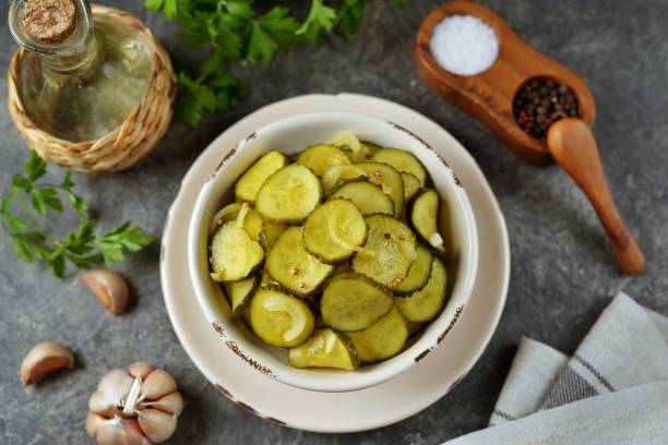 Pickled cucumber slices in mustard and coriander seeds