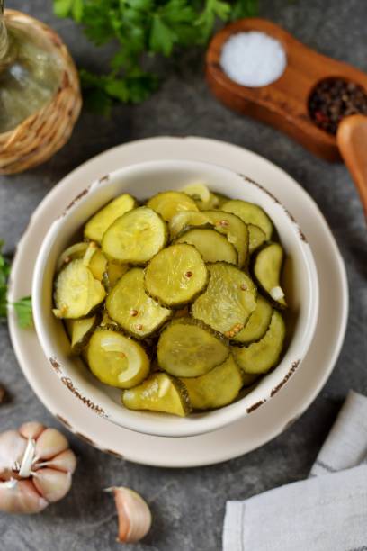 istock Pickled cucumber slices in mustard and coriander seeds 1401615993