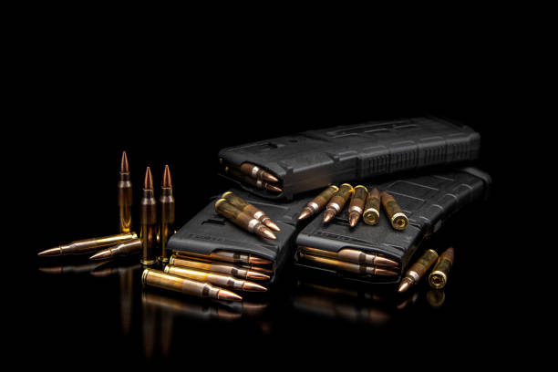 istock Bullet isolated on black background with reflexion. Rifle bullets close-up on black back. Cartridges for rifle and carbine on a black. 1401617033