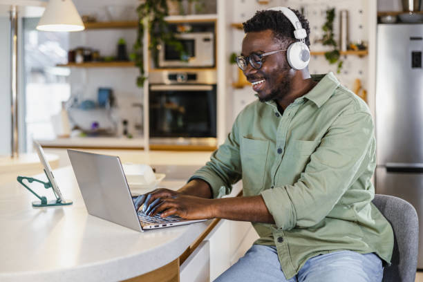 istock Young African-American man working late on the laptop 1401620974