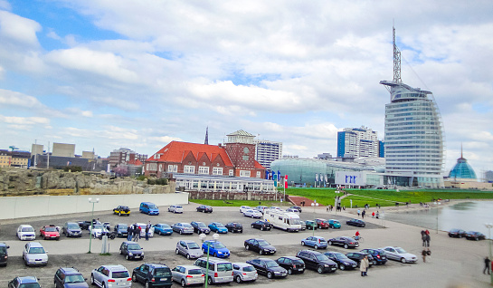 Bremerhaven Germany 02. May 2010 Cityscape and coast panorama of ATLANTIC Hotel Sail City lighthouse architecture ships boats dike and landscape of Bremerhaven in Germany.
