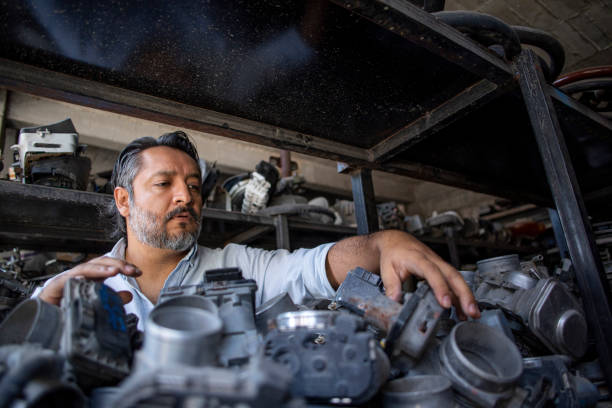 man working in used auto parts business
