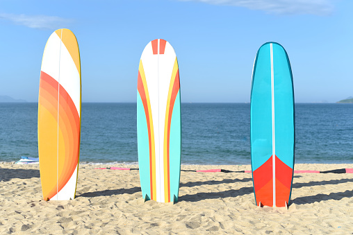 Surfboards on sandy beach in Vietnam