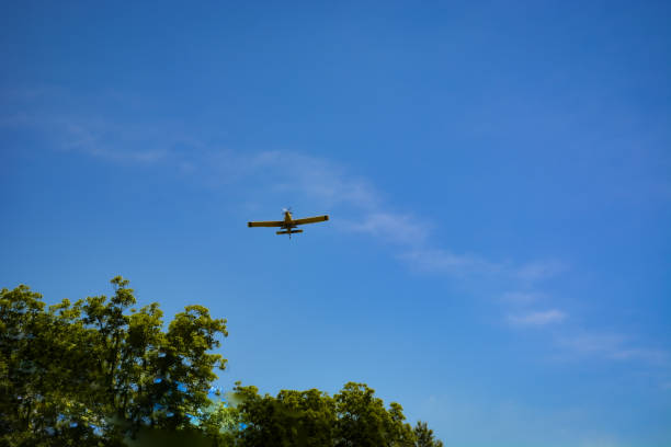 istock Propeller Plane and Vapor Trail 1401626566