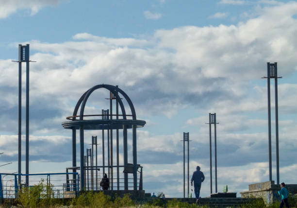 Târgu Jiu, Romania - October 31, 2020: Endless Column monument from the Sculptural Ensemble of Constantin Brancusi. Homage to the Romanian heroes of the First World War. Artistic view point with blue sky background. Dominant city landmark.