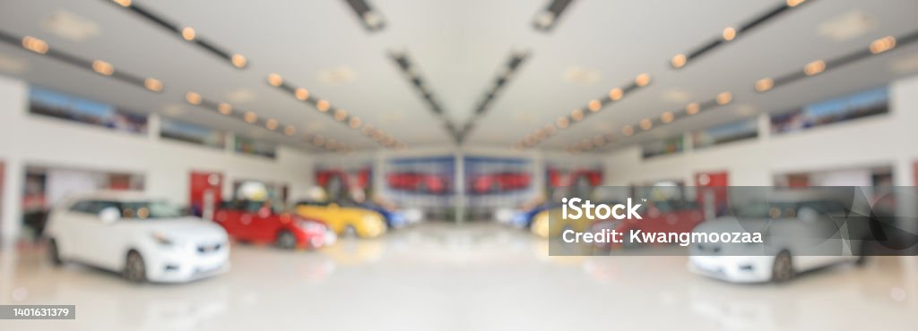 new cars in showroom interior blurred abstract background Car Dealership Stock Photo