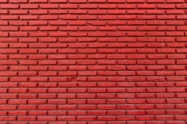 istock Red color with an old grunge wall concrete texture as a background. 1401631490
