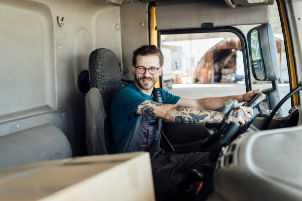 istock Delivery man starting driving and delivering packages 1401634687