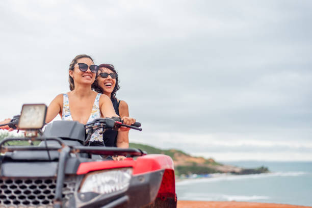 istock Friends riding ATV on the beach 1401637663
