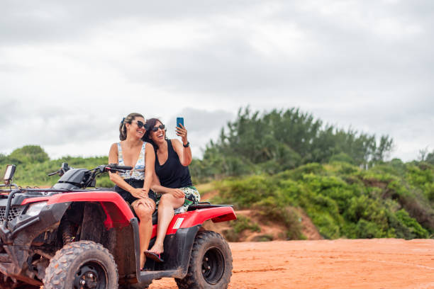 istock Friends riding ATV on the beach 1401637667