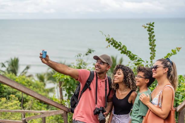istock Family taking a selfie on the beach 1401638331