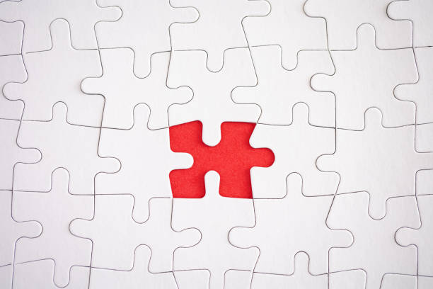 istock missing piece of jigsaw puzzle with red background 1401639498