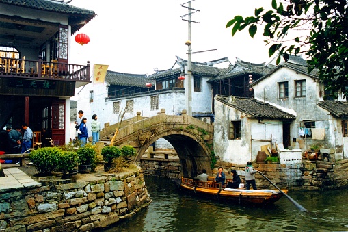 Ancient canal town Zhouzhuang, the earliest canal town in China to develop tourism.Back then, it was a little shabby and messy, but it was real.Film photo in Mar 16 1996,Suzhou,Jiangsu