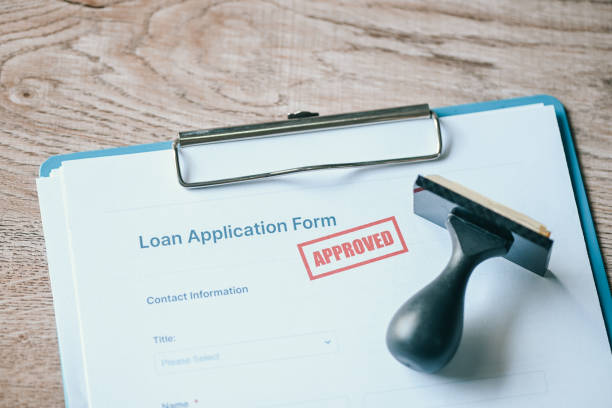 istock Loan approved on loan application form paper with rubber stamp on table, Loan approval business finance economy concept 1401643204