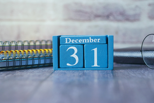 wooden calendar set on the 31 of December