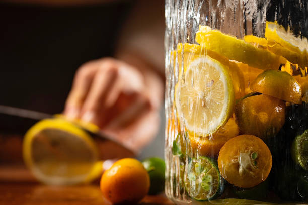 istock Sliced lemon, cool and fruity cold drink making process - stock photo 1401646440