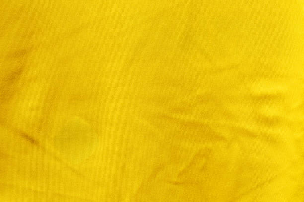 istock Yellow color fabric cloth polyester texture and textile background. 1401650946