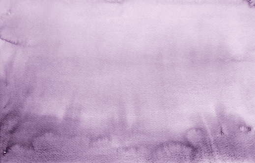 Purple watercolor background hand colored on white watercolor paper.  Close up view of texture to be used as a design element.  My own work.