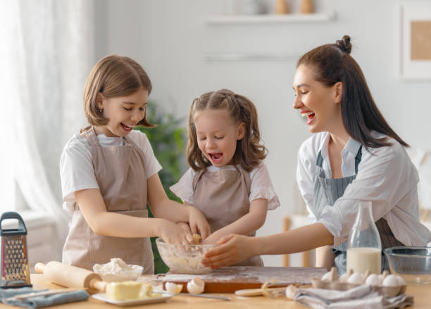 istock family are preparing bakery together 1401653727