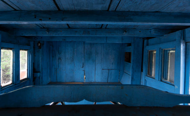 istock Old wooden boat cabin with its weathered blue paint 1401657144