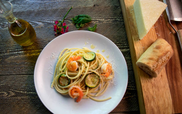 Top view of shrimp, zucchini pasta dish stock photo