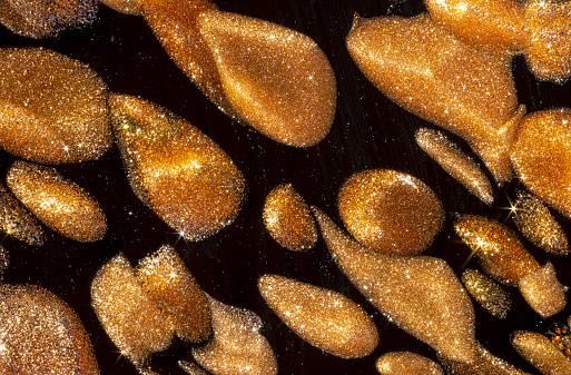 macro shot of copper golden insertions in murano black glass