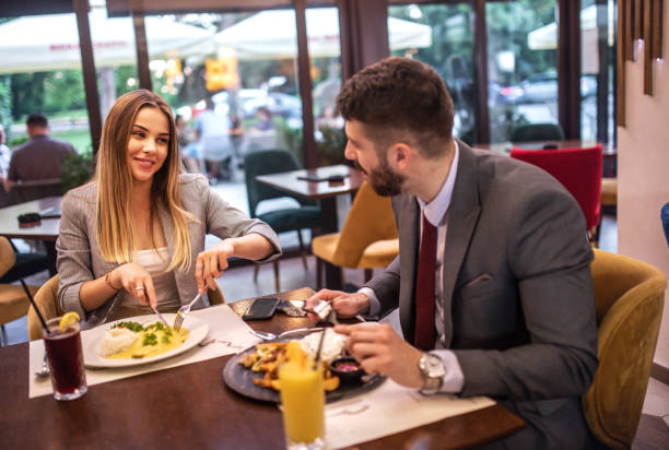 istock Business colleagues eating meal and discussing of work 1401662029