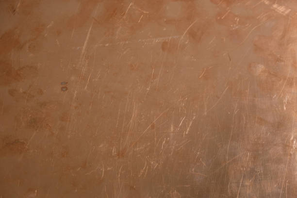 istock Textolite surface with a copper foil. Brazen background from metal-clad glass textolite. 1401665728