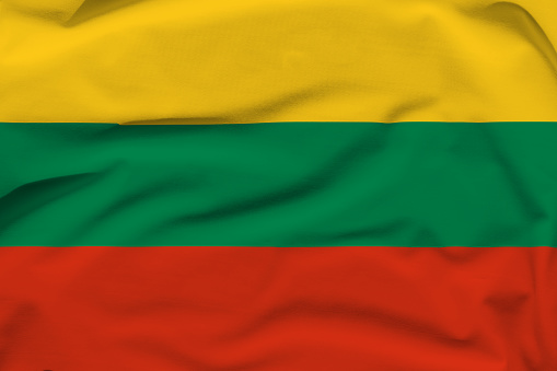 Lithuania national flag, folds and hard shadows on the canvas.