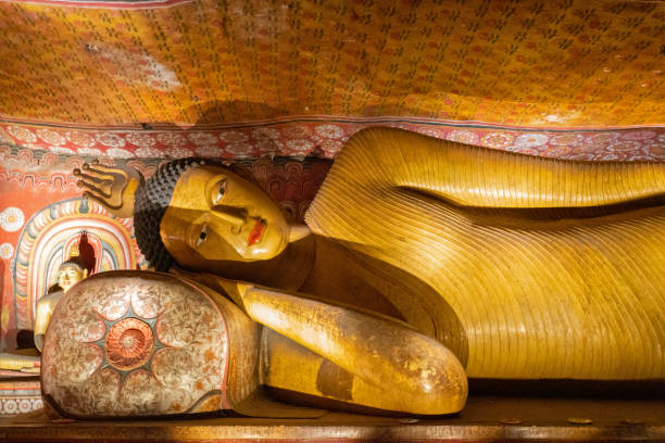 istock Buddha laying statue in Buddhist Dambulla cave temple, Sri Lanka 1401666047