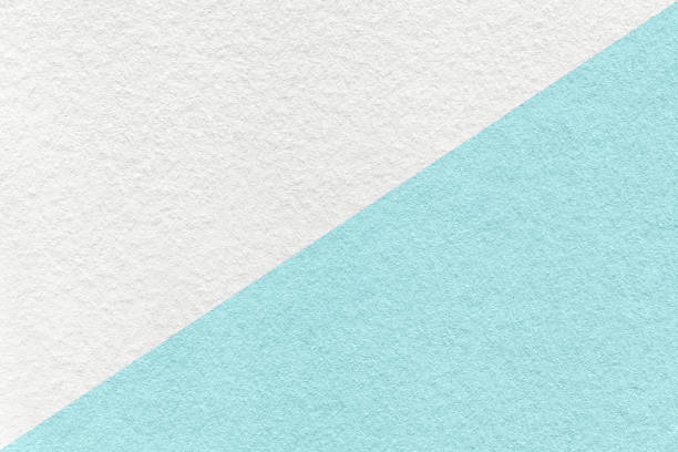 istock Texture of craft white and light blue paper background, half two colors, macro. Structure of turquoise kraft cardboard. 1401667186