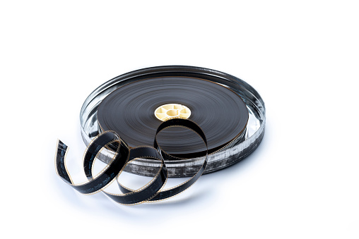 Vintage 35 mm Movie Reel with can, isolated on a white background.