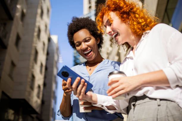 istock Smiling businesswoman using smartphone smiling 1401668938