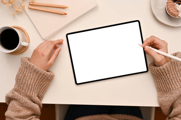istock Top view, A female freelance blogger using digital tablet touchpad 1401669331