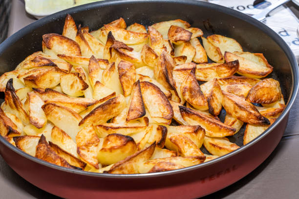 istock Roasted Backed Potato slices in a pan 1401671147