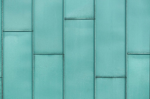 Photograph of metal panels as a cladding of an office building.