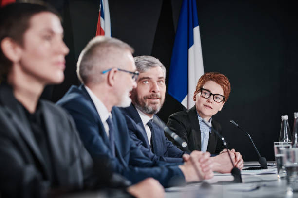 istock People discussing in team at political meeting 1401671477