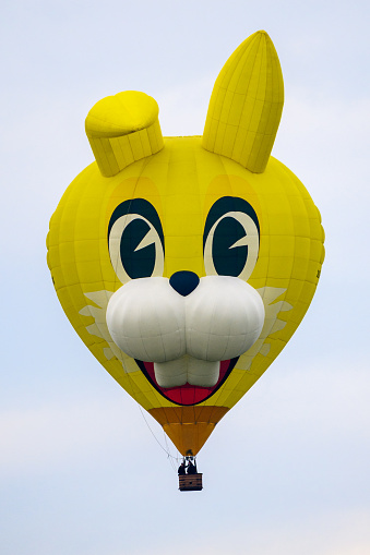 New York, USA - November 22, 2012: Hello Kitty balloon is flown with two stars on Central Park West at the 86th Annual Macy's Thanksgiving Day Parade.