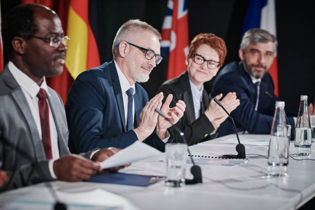 istock People greeting their collegue at conference 1401672698