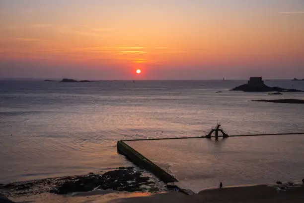 Photo of Saint-Malo natural swimming pool at sunset, brittany, France