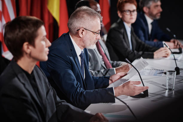 istock Senior politician presenting his point at conference 1401673016